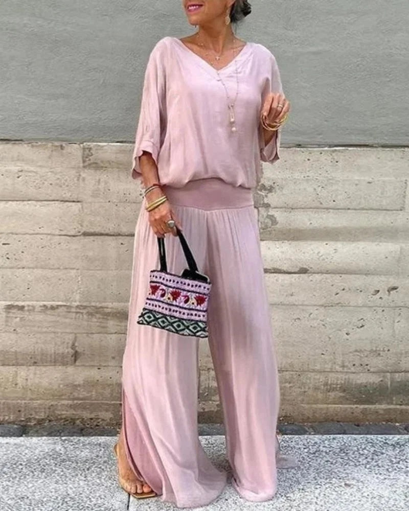 Komplet damski elegancki z bluzką oversize i spodniami z szerokimi nogawkami - Różowy