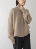 Sweter damski oversize z wysokim golfem i długimi rękawami