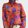 Sweter damski oversize z wysokim kołnierzem i kwiatowym wzorem